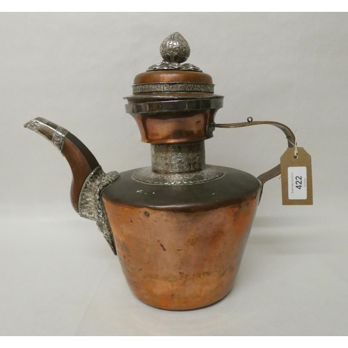 422 - A 19th century Tibetan silver mounted copper ceremonial coffee pot with lotus flower finial