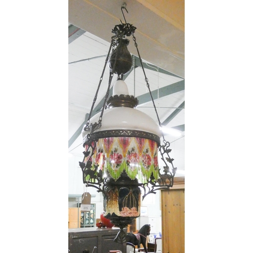 430 - A Victorian deer decorated metal framed and porcelain beaded hanging oil lamp hall fitting, overall ... 