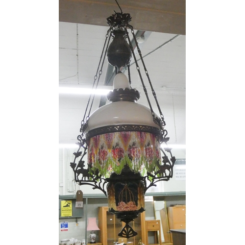 430 - A Victorian deer decorated metal framed and porcelain beaded hanging oil lamp hall fitting, overall ... 