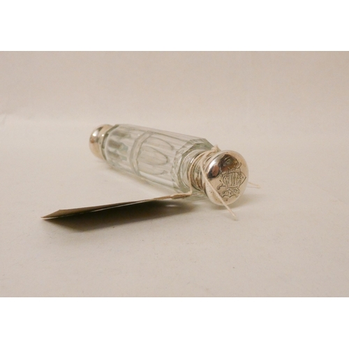 495 - A Victorian double ended clear glass scent bottle, the hinged lid to one end marked West St James's ... 