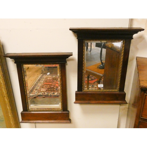 411 - A pair of Regency mahogany and gilt framed bevelled edged wall mirrors