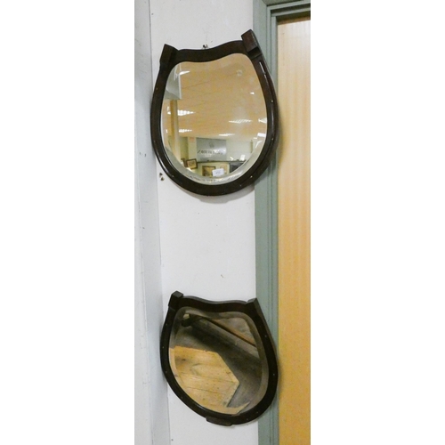 412 - A pair stained mahogany horse-shoe shaped bevelled edge wall mirrors