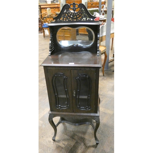 158 - A small Edwardian dark mahogany two door glazed cabinet with mirror and shelf back. 20