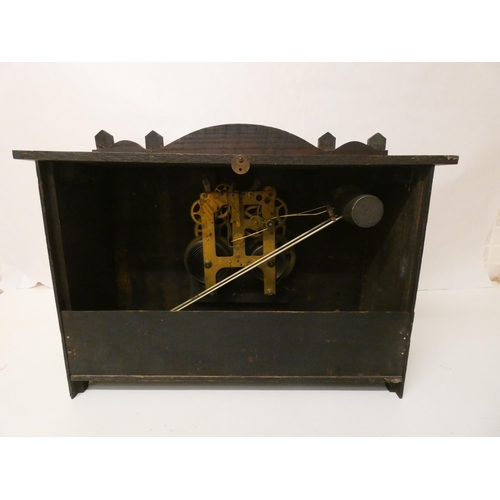 385 - An American arts and crafts oak mantel clock. US Gilbert Clock Co. Winstead Con. USA.