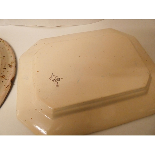 408 - A large Italian pottery bowl with old riveted decoration and a blue and white Italian meat plate