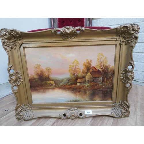 429 - A late 19th century oil on board of a cottage by a lake. 13