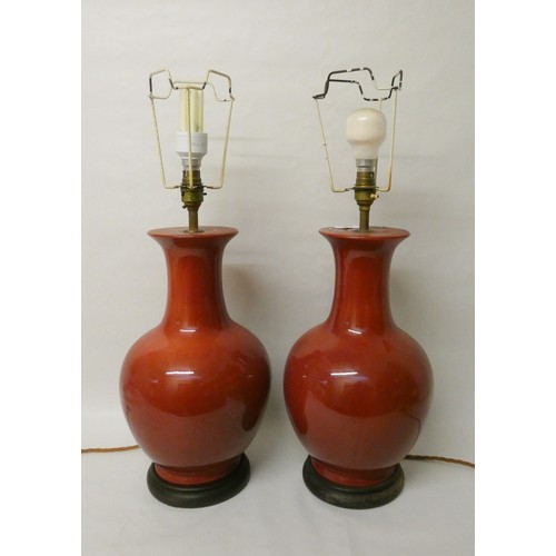 165 - Pair of Sang de Boeuf glazed table lamps on hardwood bases