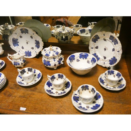 226 - A residue of a Victorian tea service decorated in blue, white and gilt grape leaves