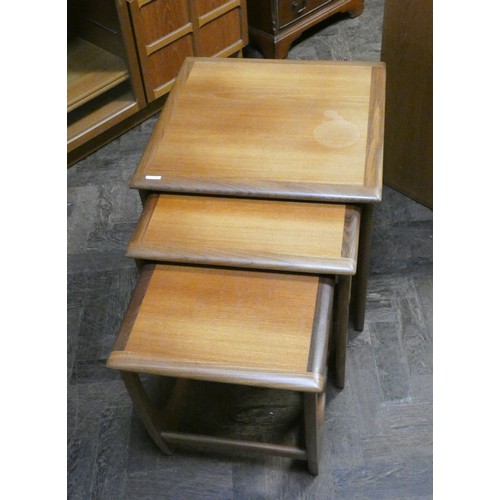 435 - A nest of three square G-plan teak coffee tables of graduated size.