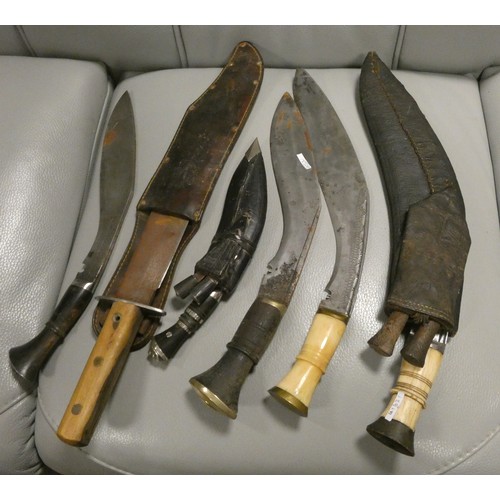 222A - A Bowie knife and three Kukri's, two with bone handles