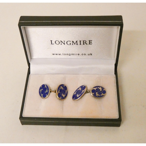 696 - A pair of Longmire silver and blue enamel cufflinks, in original box