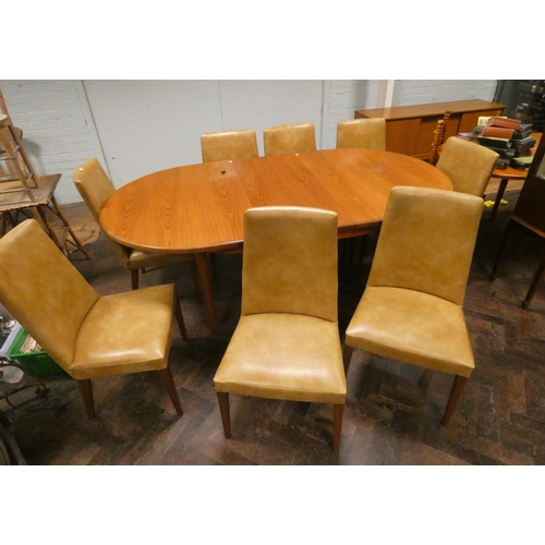 315 - An oval G-plan extending dining table with centre leaf and eight chairs with faux leather seats and ... 