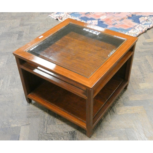 366 - A Chinese style mahogany coffee table with inset glass top and shelf under. 27