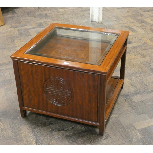 366 - A Chinese style mahogany coffee table with inset glass top and shelf under. 27