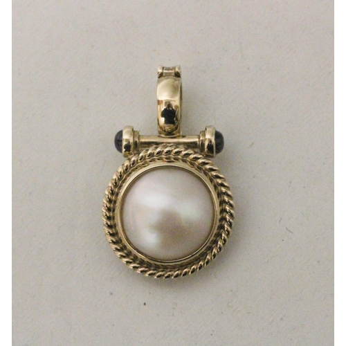 576 - A modern 9ct gold mabe pearl and cabochon sapphire pendant enhancer, the circular pearl within rope ... 