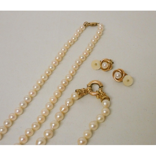 577 - A cultured pearl necklet of uniform pearls to a 9ct yellow gold claps, a matching bracelet with 9ct ... 