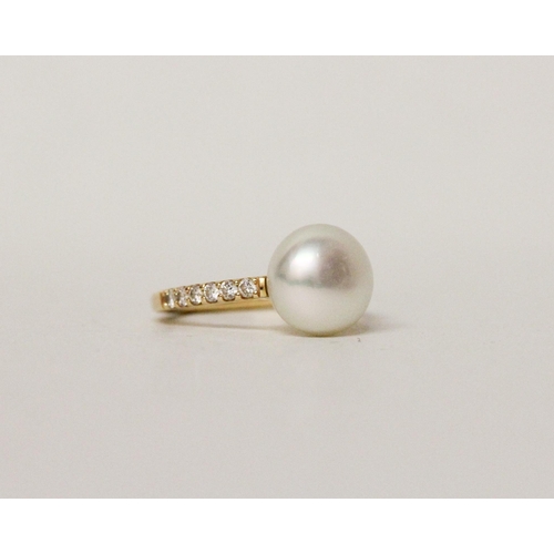 580 - South Sea pearl and diamond ring, the 11 mm pearl mounted on 18ct yellow gold pave diamond set shoul... 