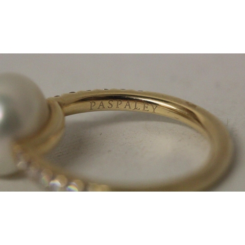 580 - South Sea pearl and diamond ring, the 11 mm pearl mounted on 18ct yellow gold pave diamond set shoul... 