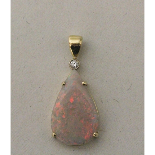 588 - Australian opal and diamond pendant, large tear drop shaped white opal claw set, with diamond set to... 