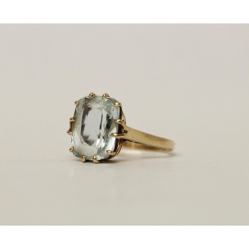 594 - A vintage large aquamarine single stone dress ring, claw set on a 9ct gold band. Ring size O gross w... 