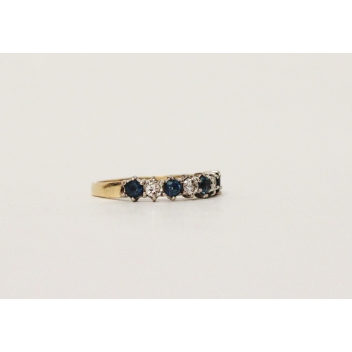 595 - A blue topaz and diamond half hoop eternity style ring, on 18ct yellow gold band. Hallmarked, ring s... 