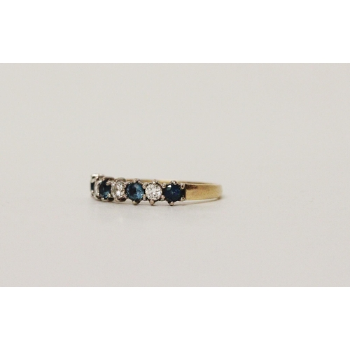 595 - A blue topaz and diamond half hoop eternity style ring, on 18ct yellow gold band. Hallmarked, ring s... 