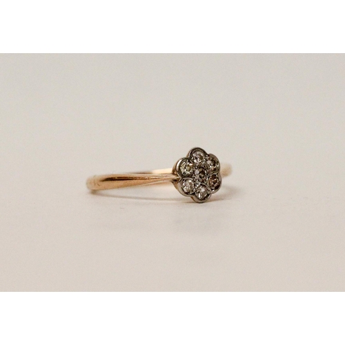 601 - A 1930's diamond flower cluster ring, yellow gold band stamped 18ct. Ring size O, gross weight 2.1g