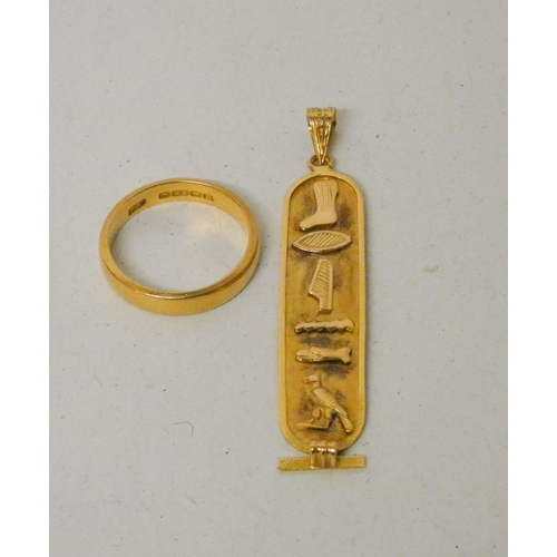 611 - Middle Eastern gold hieroglyph style pendant, 2.9 grams, together with a hallmarked 22ct gold weddin... 