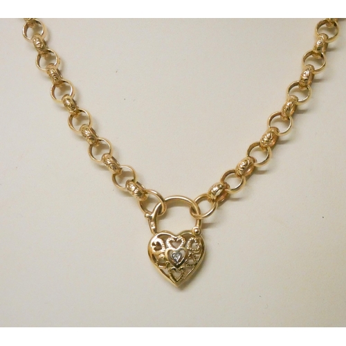 631 - A Victorian style heart shaped pendant necklace, the diamond heart shaped padlock on an engraved bel... 