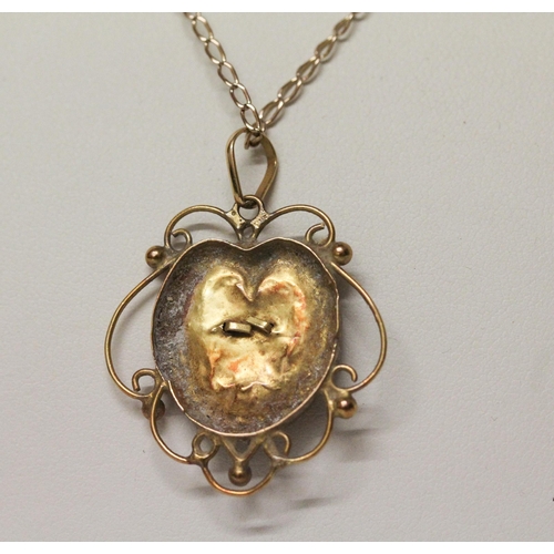 632 - An Arts & Crafts gold and enamel pendant, on a fine 9ct gold chain. Chain hallmarked. Gross weight 5... 