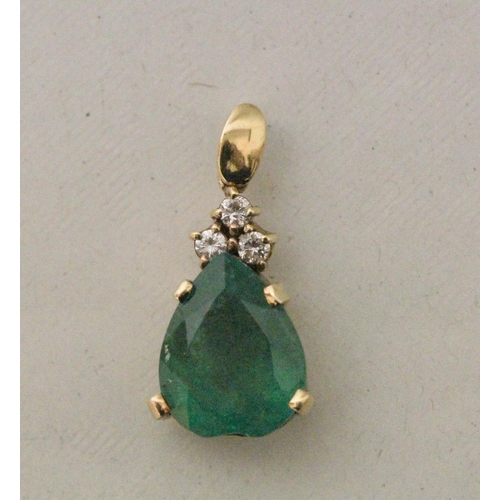 634 - A large emerald and diamond teardrop shaped pendant. The heart shaped emerald claw set with three br... 