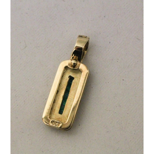 635 - An emerald and diamond pendant in the Art Deco style, the rectangular pendant channel set with emera... 