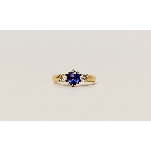 640 - A sapphire and diamond  three stone ring, on 18ct gold band.  Ring size G/H. weight 3g