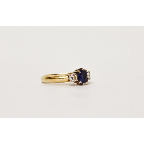 640 - A sapphire and diamond  three stone ring, on 18ct gold band.  Ring size G/H. weight 3g