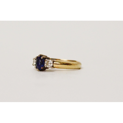 640 - A sapphire and diamond  three stone ring, on 18ct gold band.  Ring size G/H. weight 3g