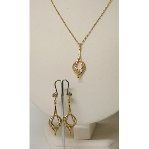 653 - Ola Gorie Scottish Arts & Crafts style 9ct gold pendant and drop earrings set. Hallmarked. Gross wei... 