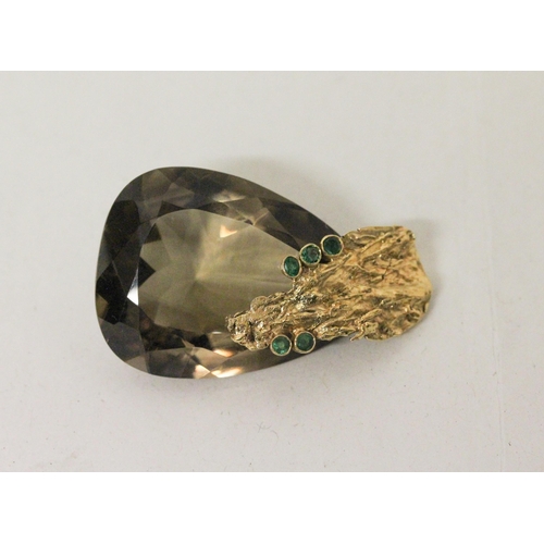 654 - A statement bespoke made smoky quartz and emerald pendant, the large faceted tear drop quartz suspen... 