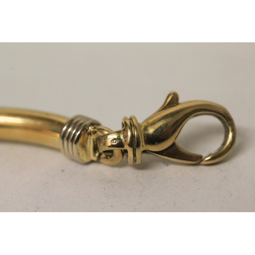 655 - An 18ct yellow gold bangle, of hinged jointed design, with large lobster clasp. Marked 750. Gross we... 