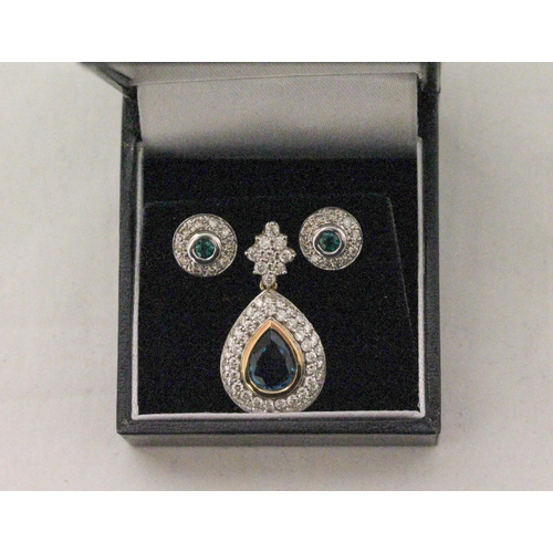 656 - An emerald and diamond tear drop shaped cluster pendant and pair of matching circular cluster stud e... 