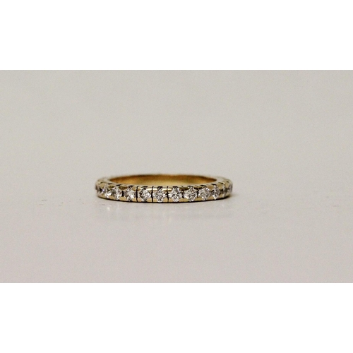 660 - A diamond eternity ring, fully diamond set with brilliant cut diamonds, in 18ct yellow gold. Ring si... 