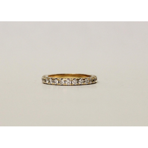 660 - A diamond eternity ring, fully diamond set with brilliant cut diamonds, in 18ct yellow gold. Ring si... 