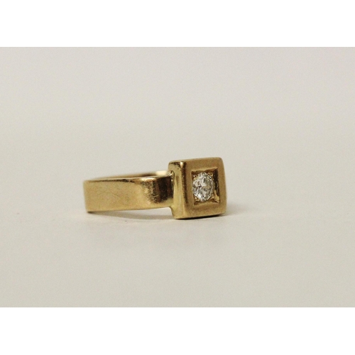 664 - A modern diamond pinky ring, of unusual square form, with a single brilliant cut diamond within a sq... 