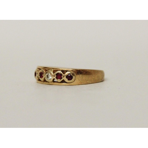 666 - A ruby and diamond ring, on 18ct yellow gold band, ring size I, marked 750. Gross weight 3 grams