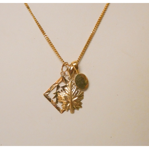 671 - Chinese 14k gold pendant and a 9ct maple leaf pendant on a rolled gold chain.