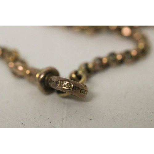 699 - A Victorian 9ct rose gold belcher link long guard chain, marked 9ct on clasp. Gross weight 17.1g. Le... 