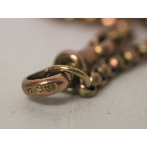 699 - A Victorian 9ct rose gold belcher link long guard chain, marked 9ct on clasp. Gross weight 17.1g. Le... 