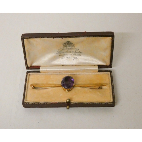 700 - An Edwardian amethyst bar brooch, bar marked 10ct. In Hamilton & Inches fitted red leather box. Gros... 