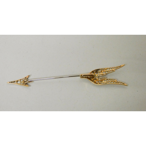 706 - An Art Deco diamond 'Flaming Arrow' jabot pin, circa 1920, set with old rose cut diamonds in white a... 