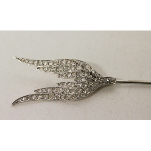 706 - An Art Deco diamond 'Flaming Arrow' jabot pin, circa 1920, set with old rose cut diamonds in white a... 