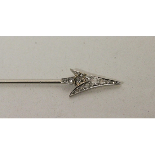 706 - An Art Deco diamond 'Flaming Arrow' jabot pin, circa 1920, set with old rose cut diamonds in white a... 